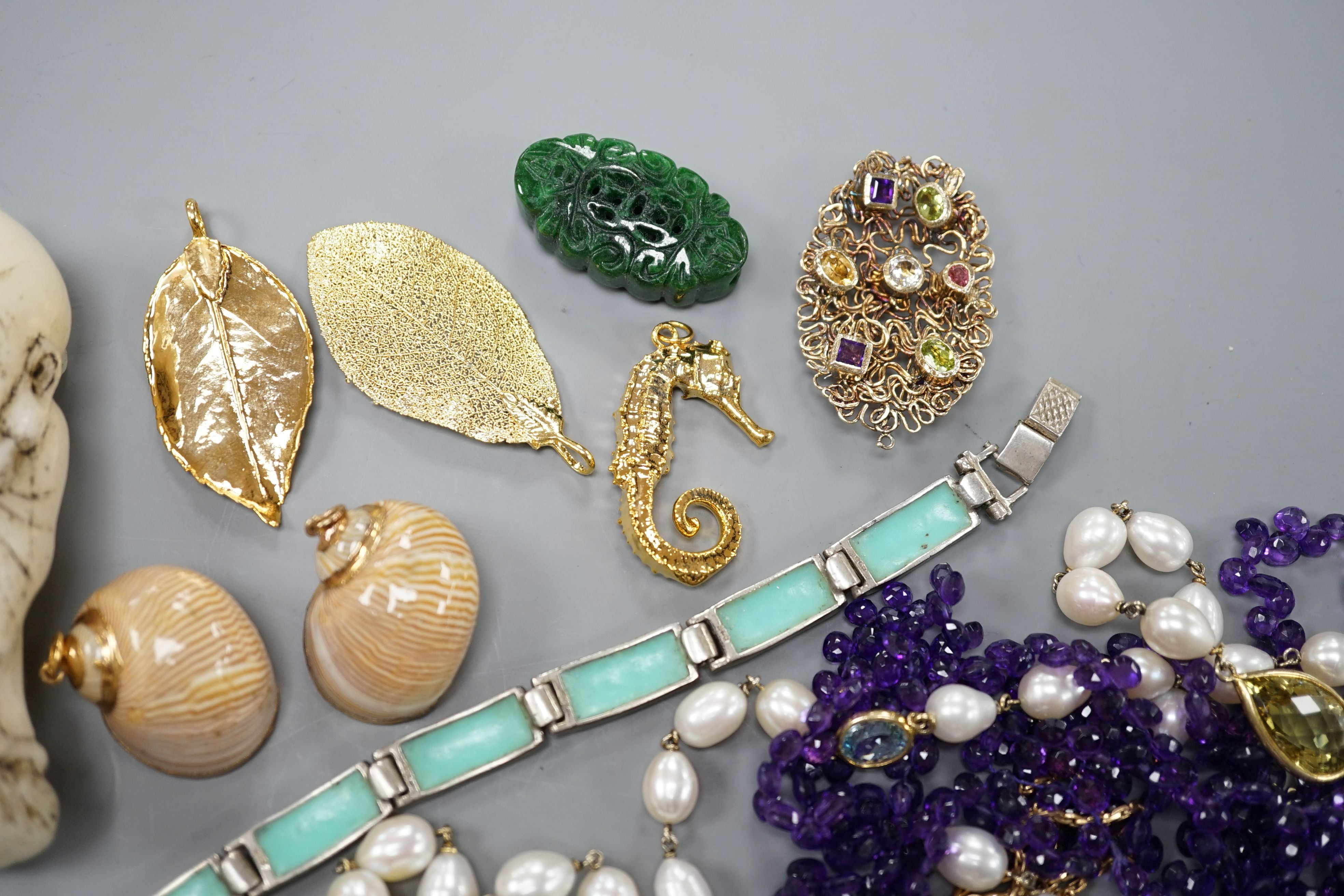 A group of minor costume jewellery including an amethyst bead necklace
